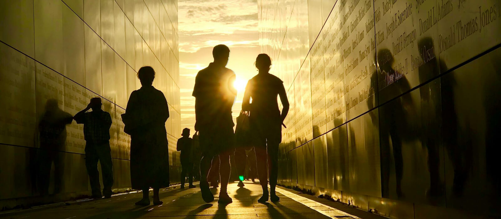 People walking in-between buildings